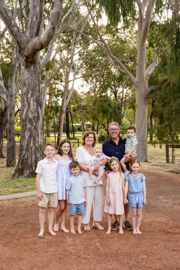 Large extended family photographed outdoors in Perth during a multi generation family session