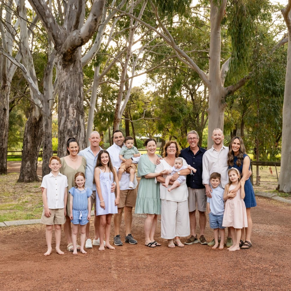 Large extended family photographed outdoors in Perth during a multi generation family session