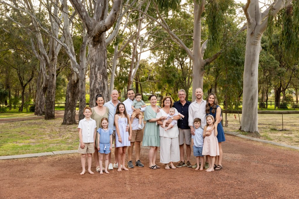 Large extended family photographed outdoors in Perth during a multi generation family session