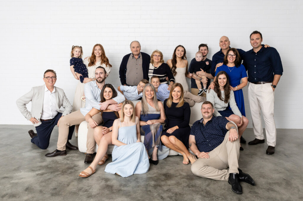 large family group relaxed pose studio extended family photography Perth