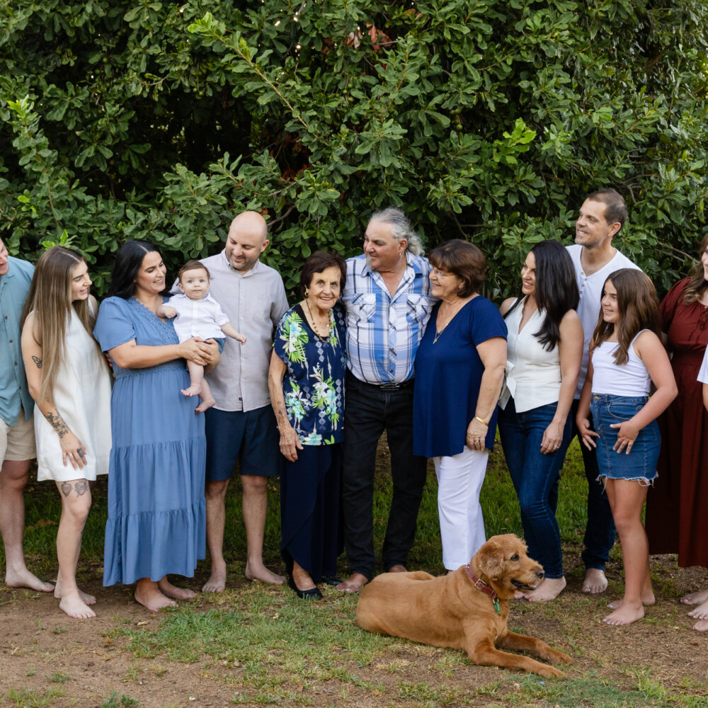 multigenerational extended family group outdoors with golden retriever, extended family photoshoot Perth
