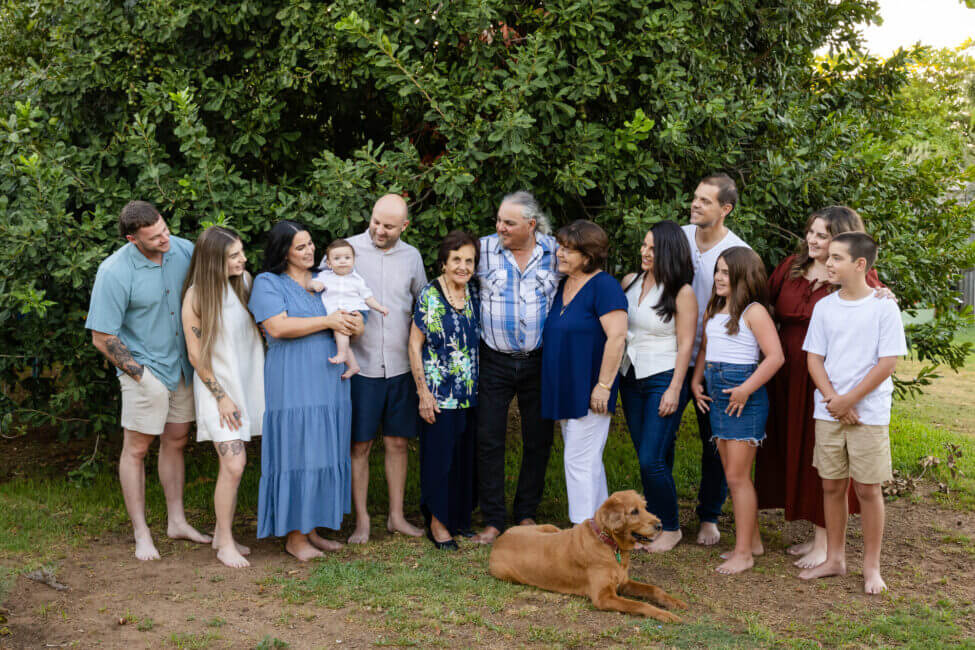 multigenerational extended family group outdoors with golden retriever, extended family photoshoot Perth