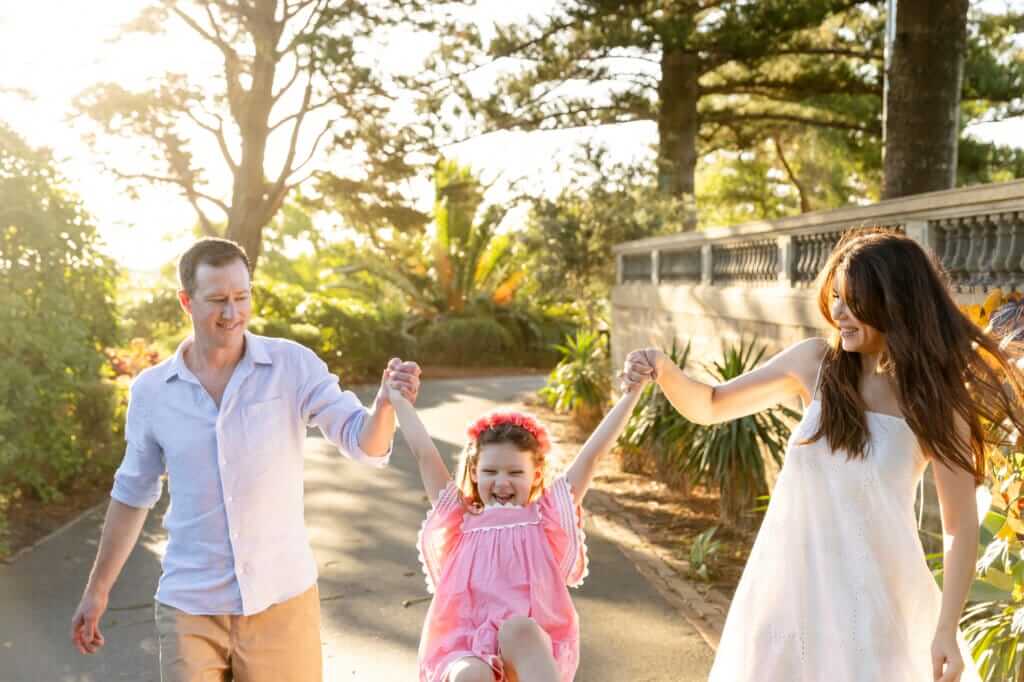 Perth family swinging their daughter