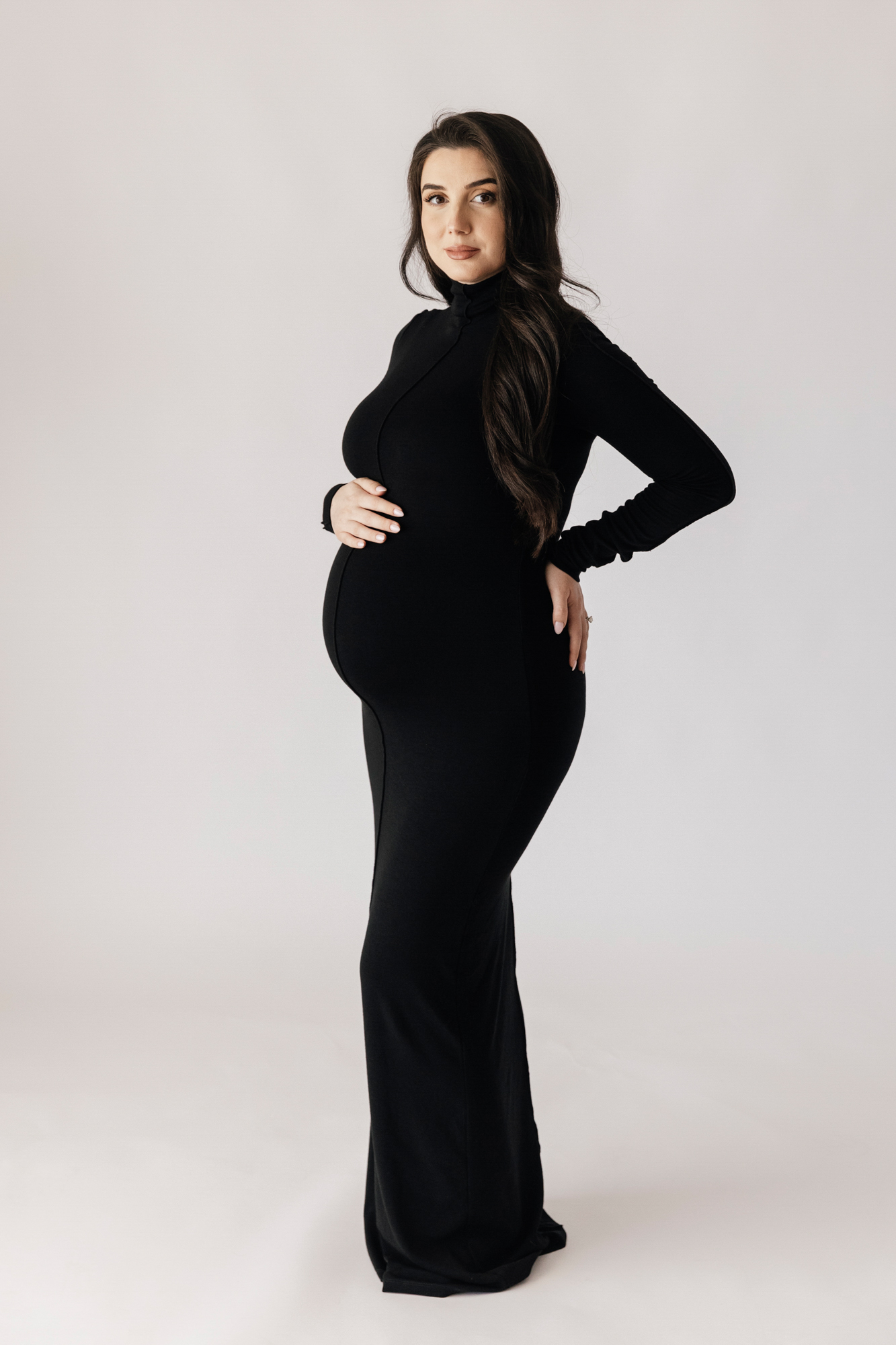 pregnant woman in black gown side profile, studio maternity photographer Perth