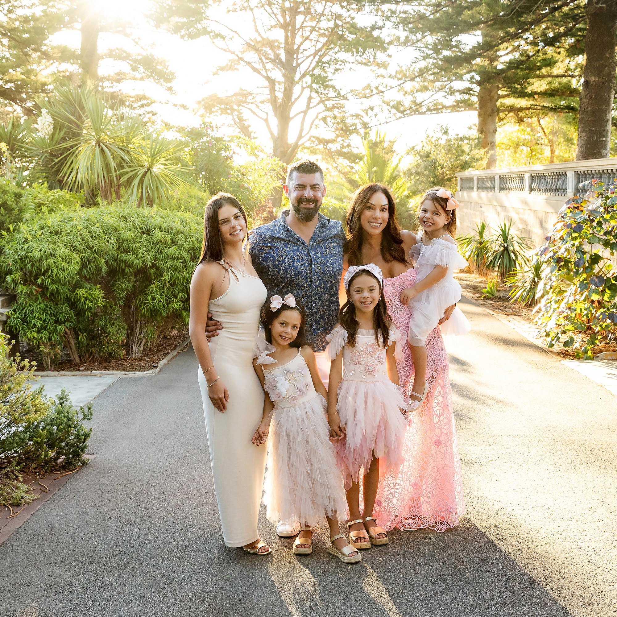 family photography Perth - family of six with four daughters in pink dresses at golden hour