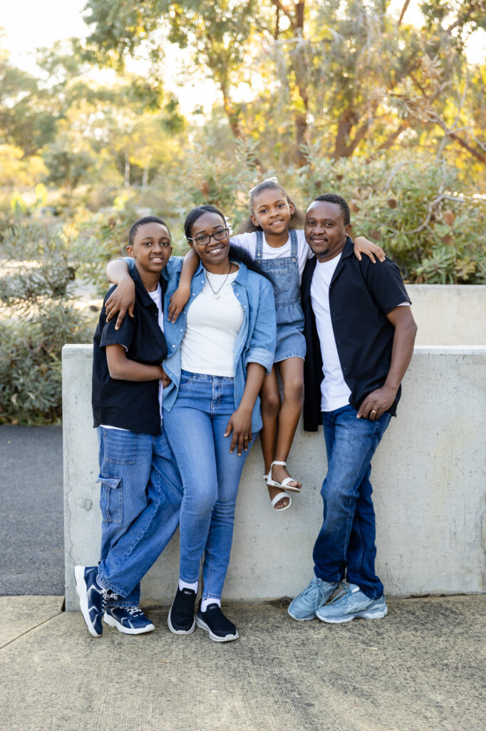 Family of four smiling together, Perth family photographer Erica Serena