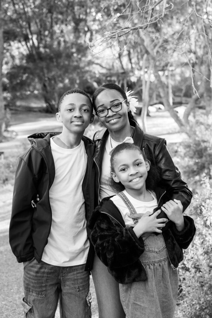 mum with her two children hugging outdoors, Perth family photographer
